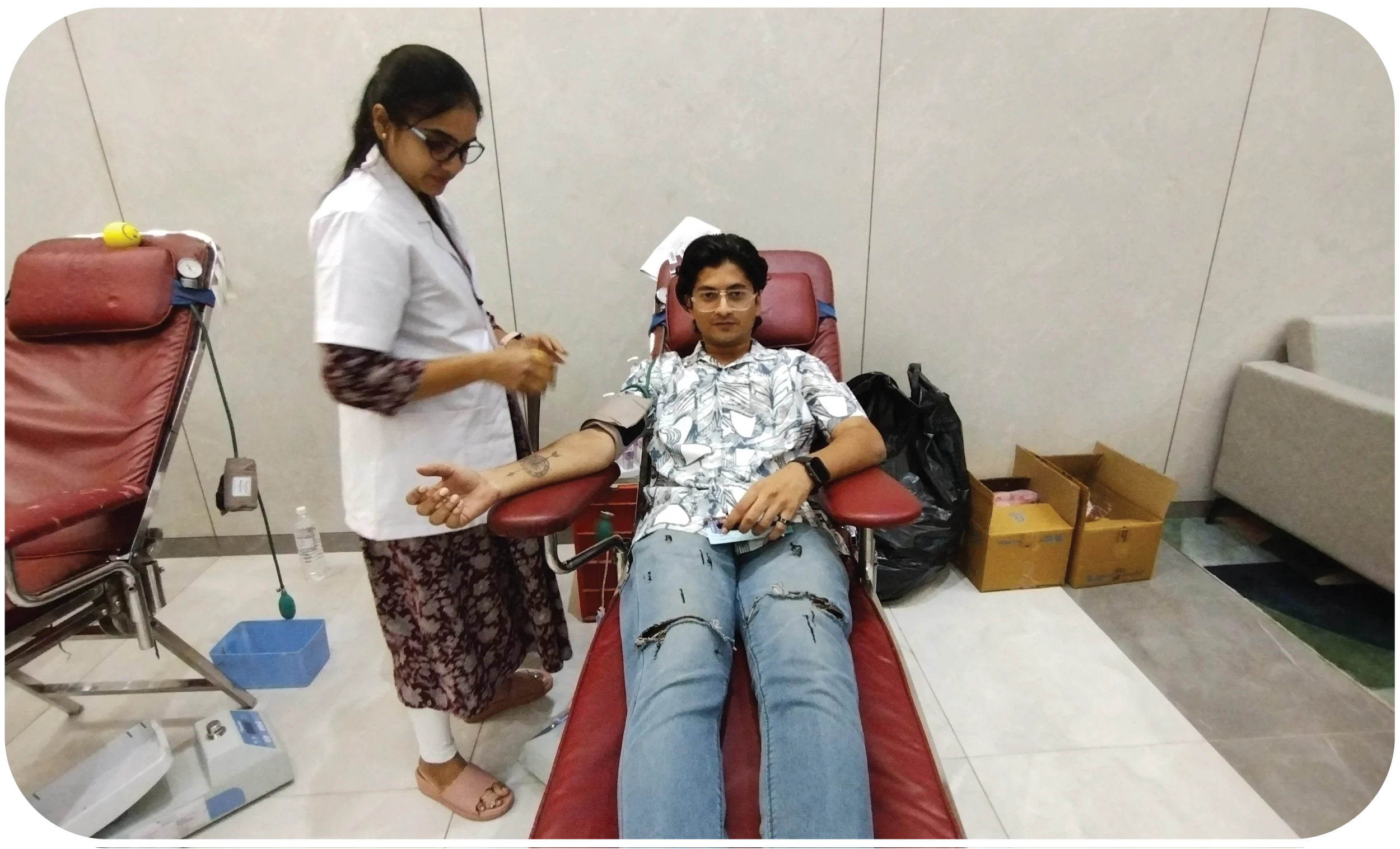 Speaker addressing audience at blood donation awareness event